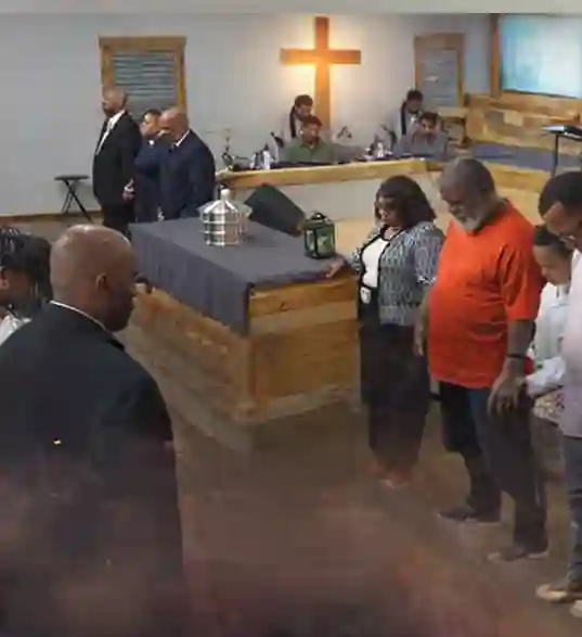 church members holding a donation basket